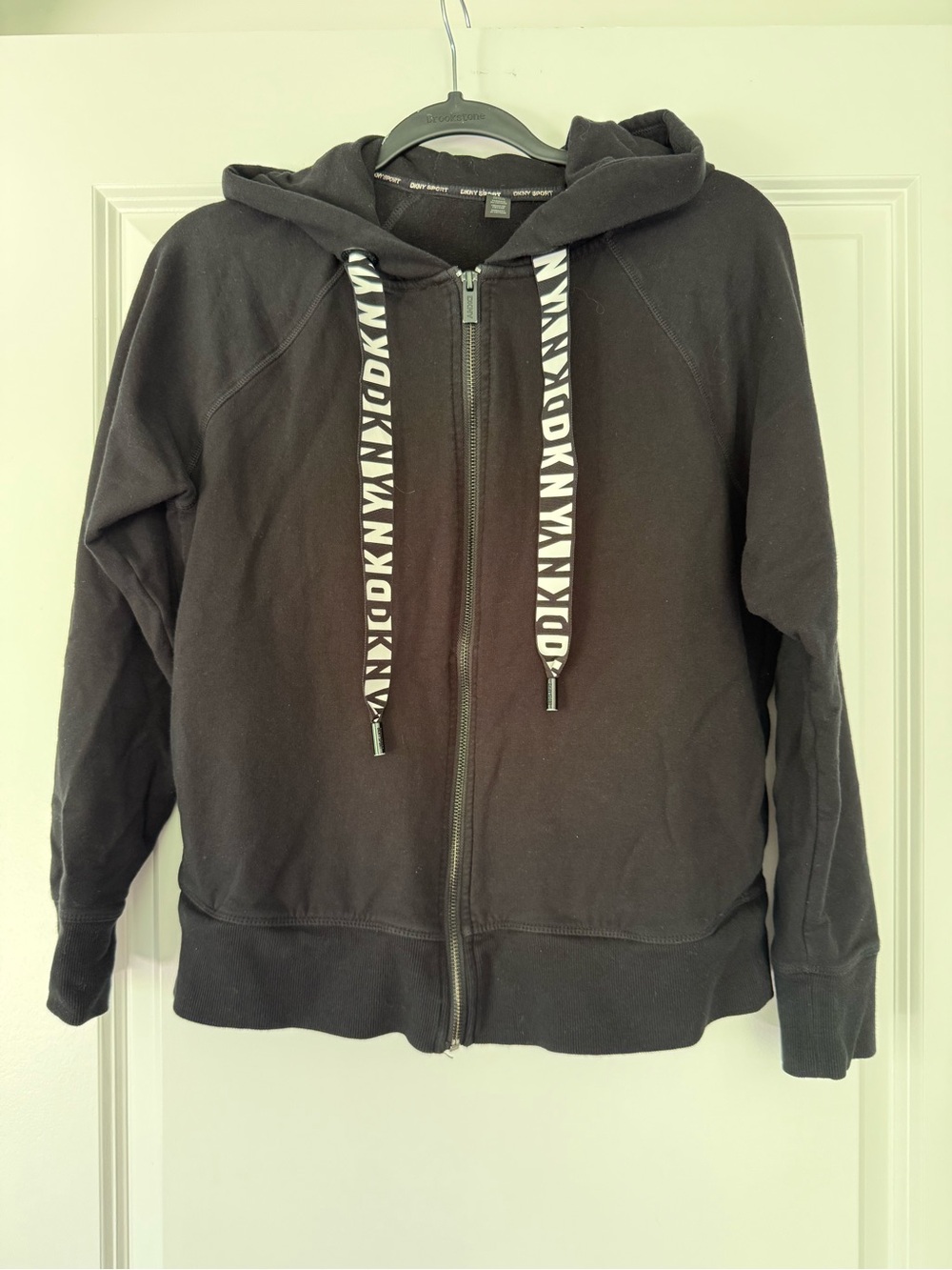 DKNY Sport Black Apparel Tag with White Logo Text